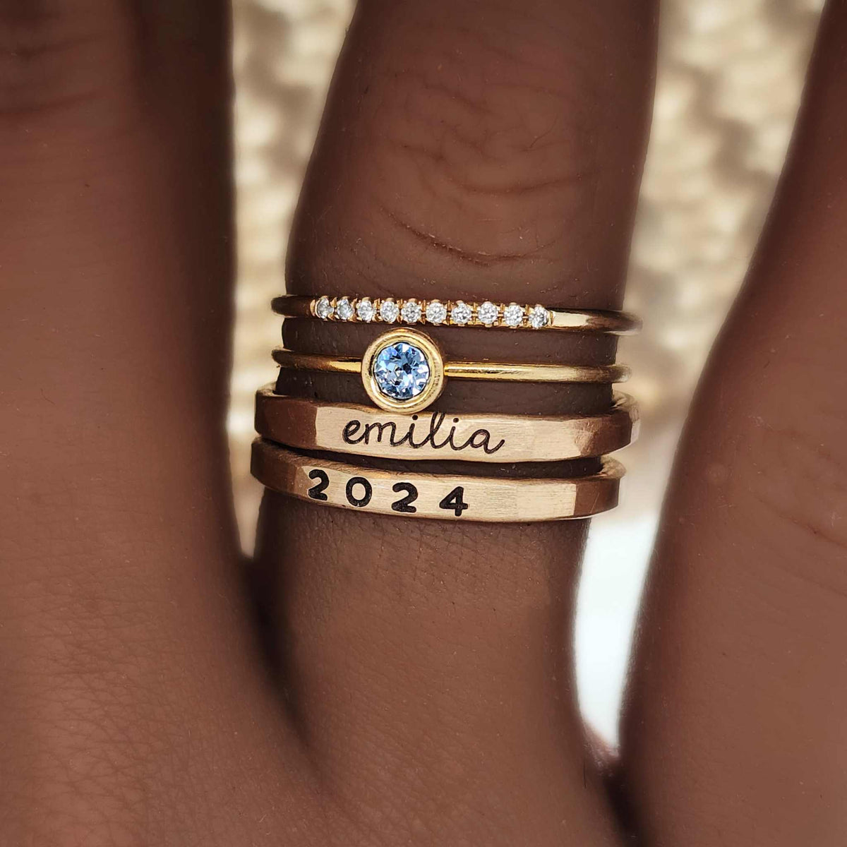 Close-up of hands cleaning delicate jewelry with a soft brush, highlighting Jewelry Care 101 tips and tricks to keep pieces shining