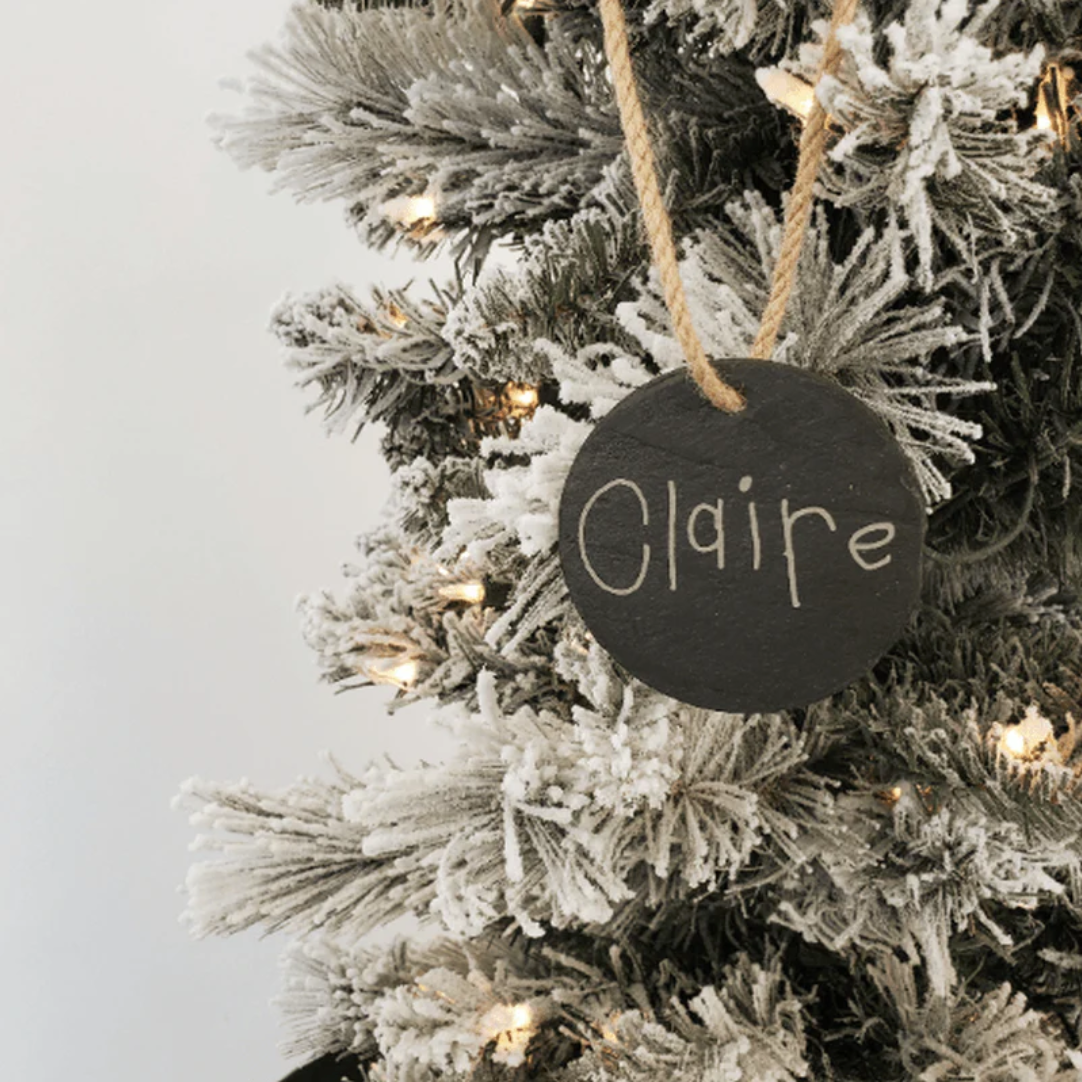 Personalized holiday gifts including custom ornaments with names and dates