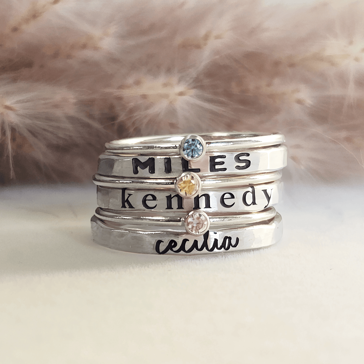 silver personalized handmade stacking rings engraved with names in different fonts