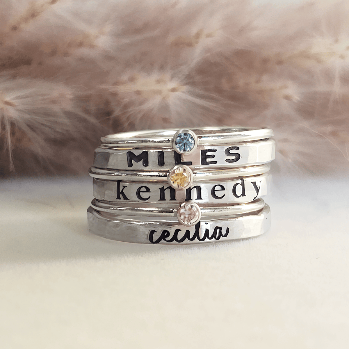 silver personalized handmade stacking rings engraved with names in different fonts