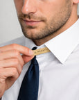 Man adjusting collar stay with name McKayla
