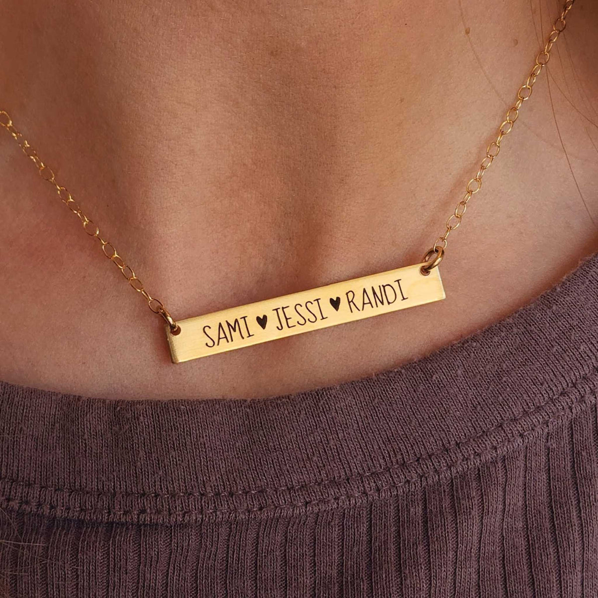 Elegant engraved bar name necklace on 14K gold-filled chain with brushed finish and customizable text