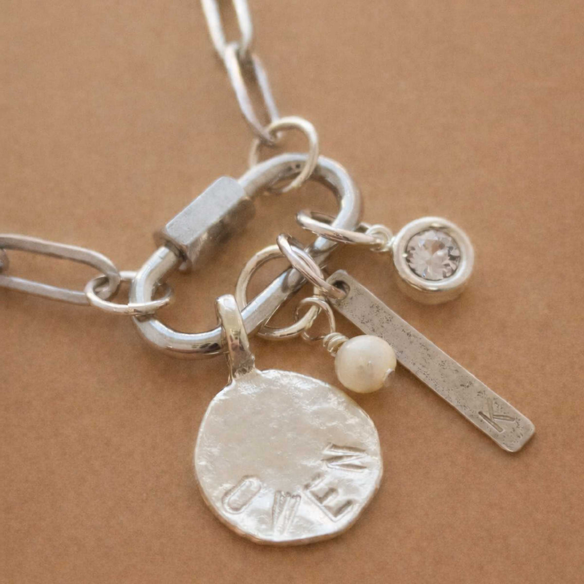 Silver carabiner paperclip necklace with stainless steel charm and secure clasp