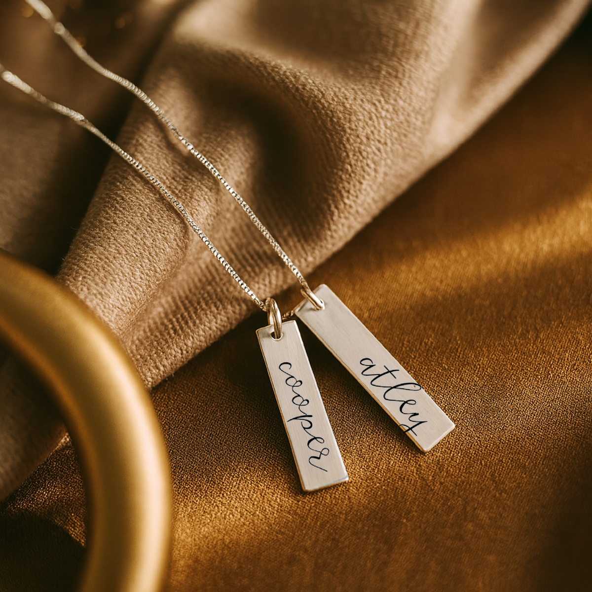 Elegant cursive name necklace in gold with custom lowercase engraving on 18-inch chain