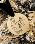 Custom child drawing ornament engraved with stick figure family on gold round base with velvet ribbon