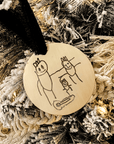 Custom child drawing ornament engraved with stick figure family on gold round base with velvet ribbon