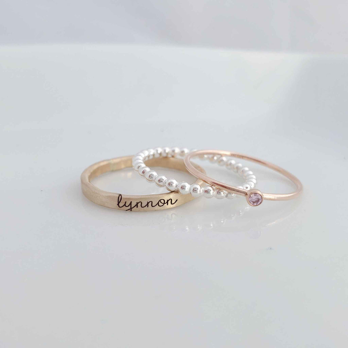 yellow gold personalized ring engraved in our lower cursive font, sterling silver beaded ring, rose gold birthstone ring