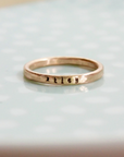 Single 2mm 14k rose gold-filled ring handstamped with a name