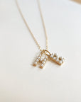 Pearl initial necklace with letter 'H' and 'B'