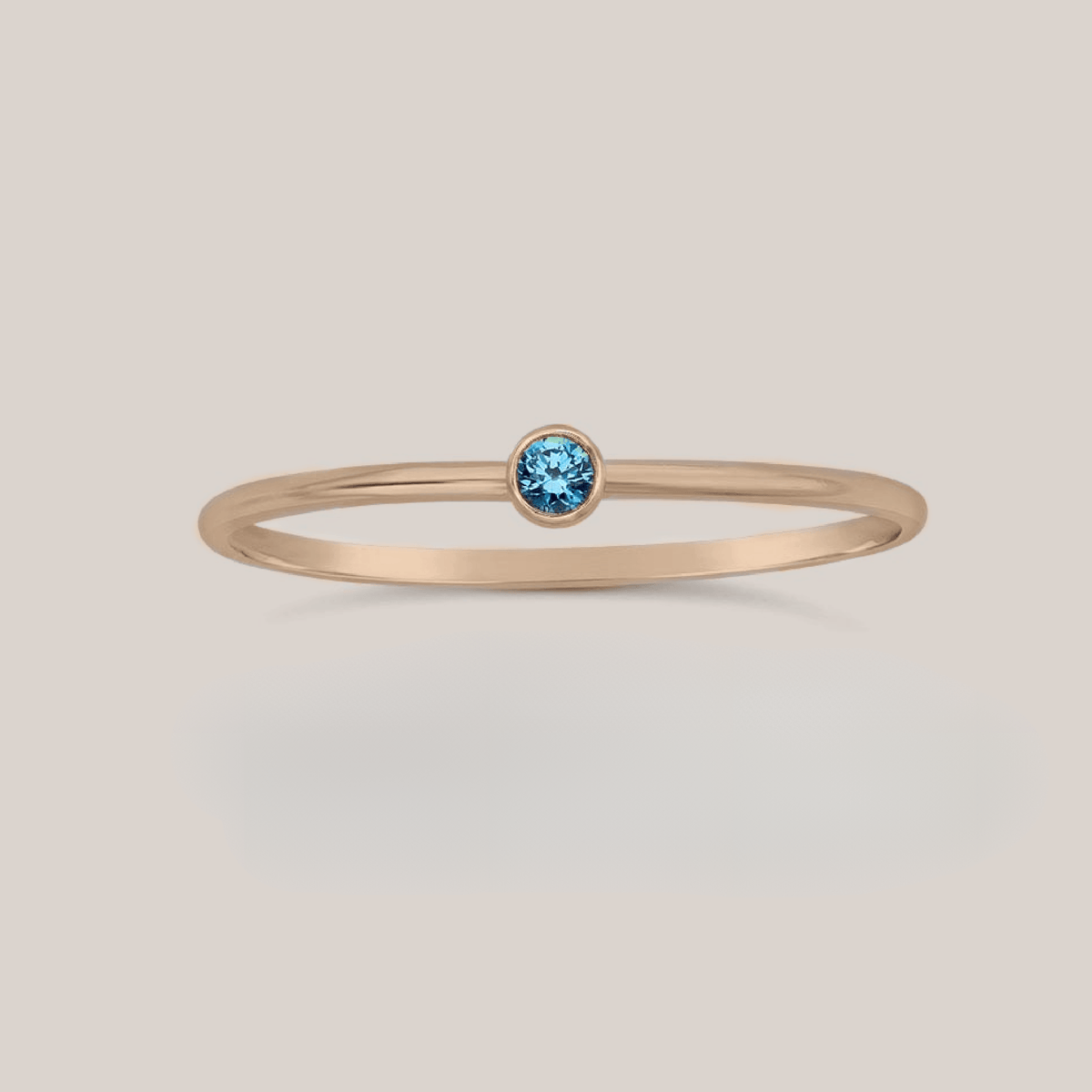 September Stacking Birthstone Ring with 2mm blue crystal on slim 1mm band in rose gold, yellow gold, or silver