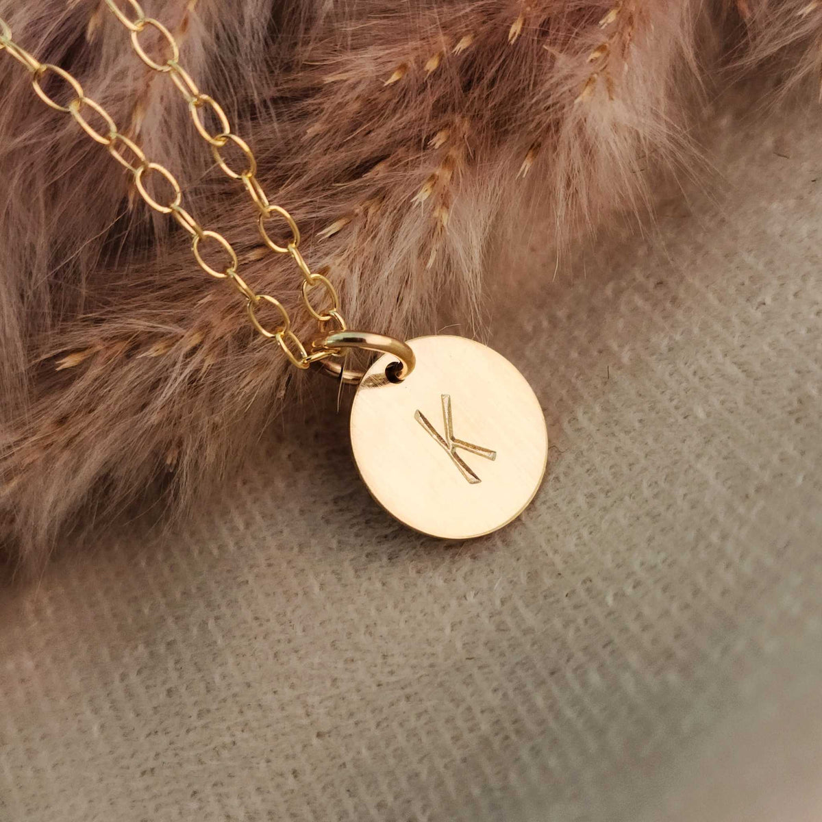 Dainty initial necklace with .5" round pendant, hand-stamped lowercase initial, available in 14K gold-filled, rose gold-filled, and sterling silver