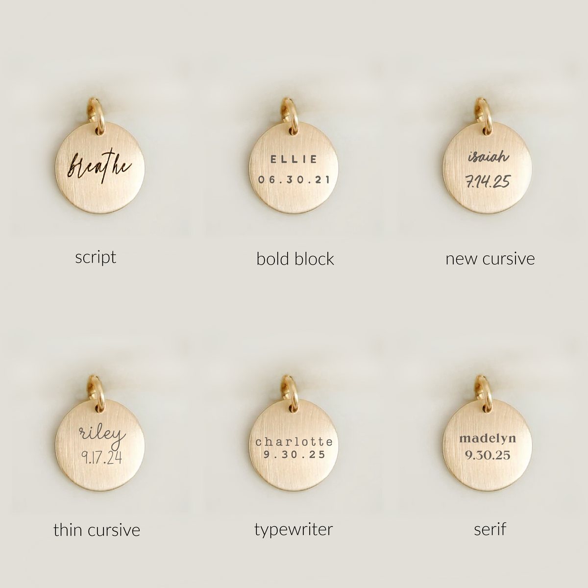 Gold pendants with different text styles on a light gray background