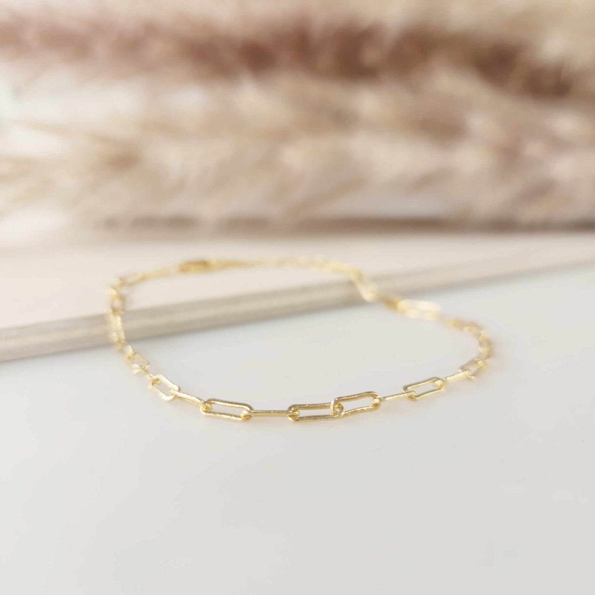 14K yellow gold filled paperclip bracelet with 2.5mm width and adjustable 6.5" length