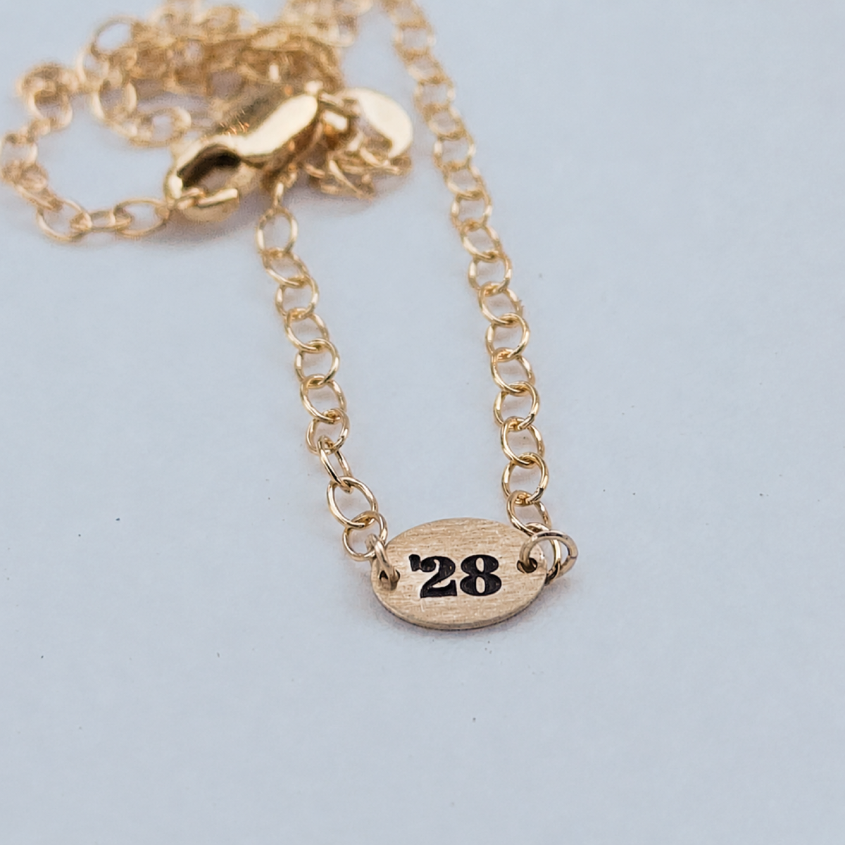 Delicate 14K gold-filled Favorite Year Necklace with engraved oval and adjustable cable chain