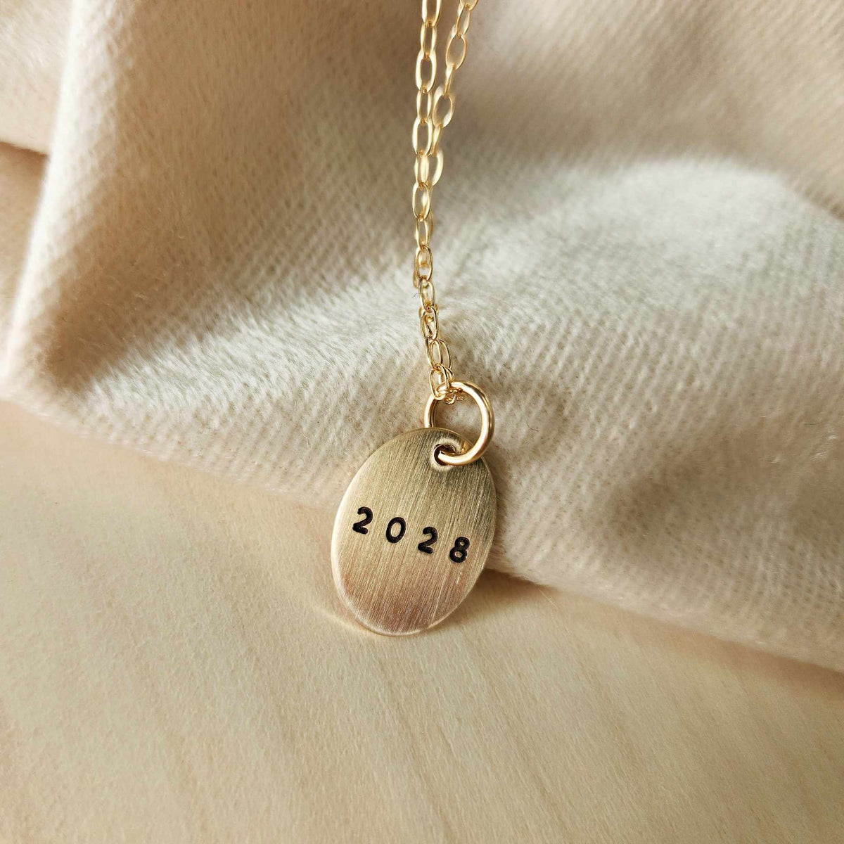 Graduation year necklace oval pendant in sterling silver with 18-inch cable chain