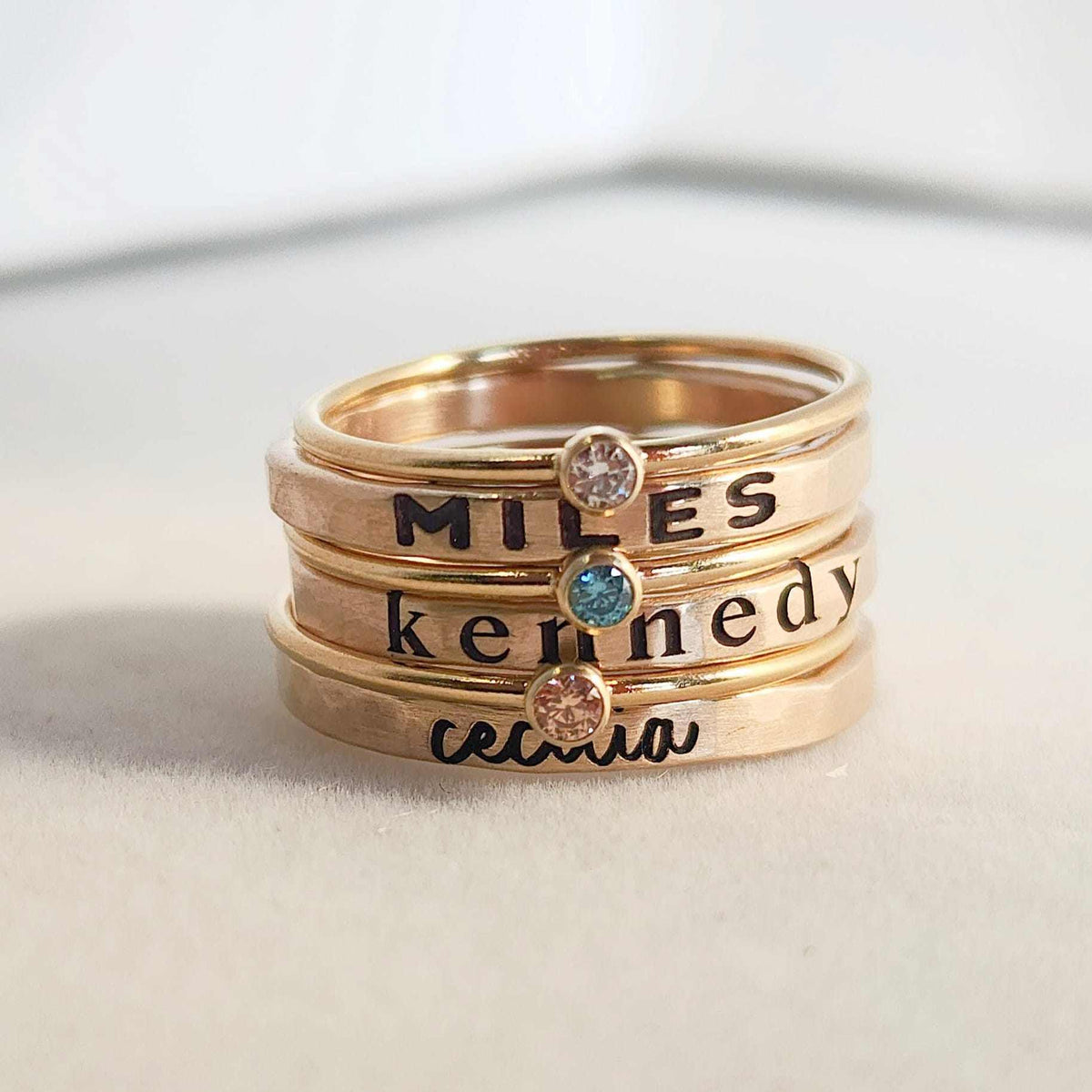 Stacked Oakleigh Ring Set with personalized name and birthstone rings in gold and silver