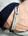 Bracelet with engraved names worn on wrist