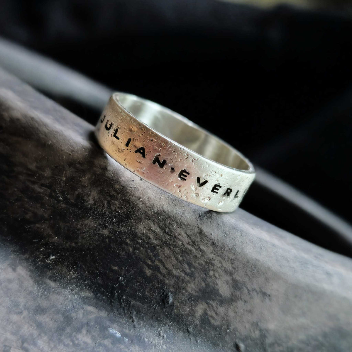 Men’s sterling silver name ring with rugged sandcast texture and deep engraving