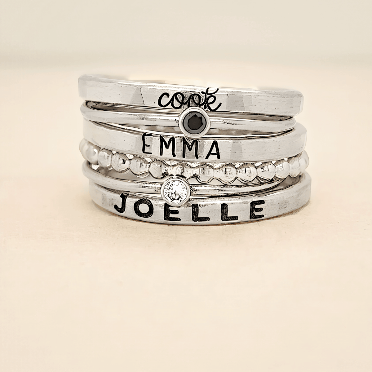 silver personalized ring set engraved with bold font names