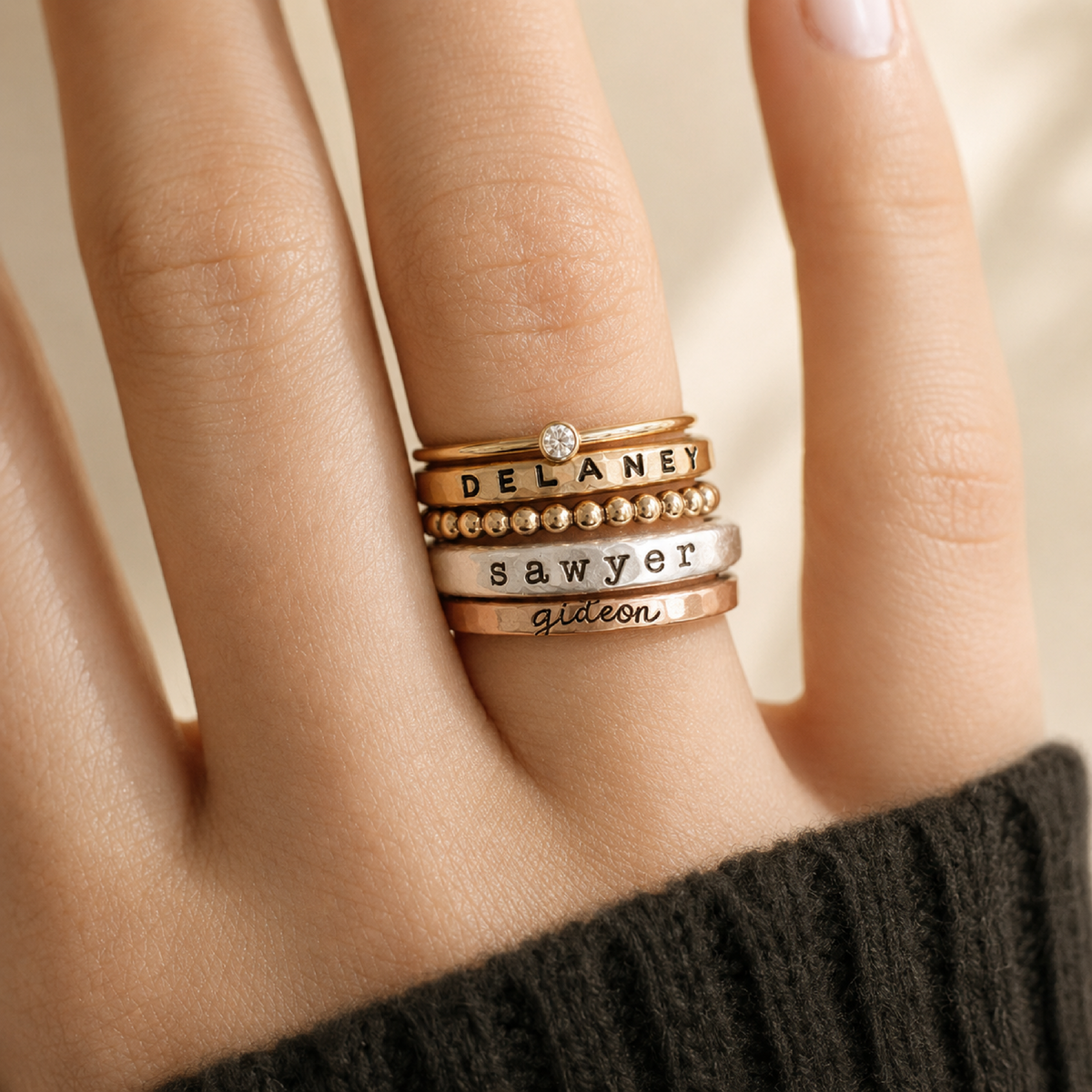 The Arianna Set of mixed metal personalized rings including birthstone, name, beaded, and thick organic silver rings