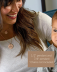 Woman holding a child with pendants displayed on a text box
