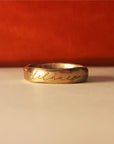 Gold ring with "Delaney" undarkened