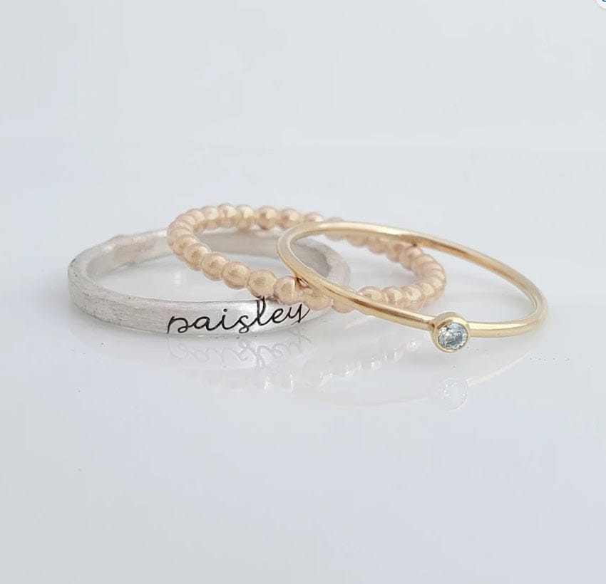 Three rings on a light gray background