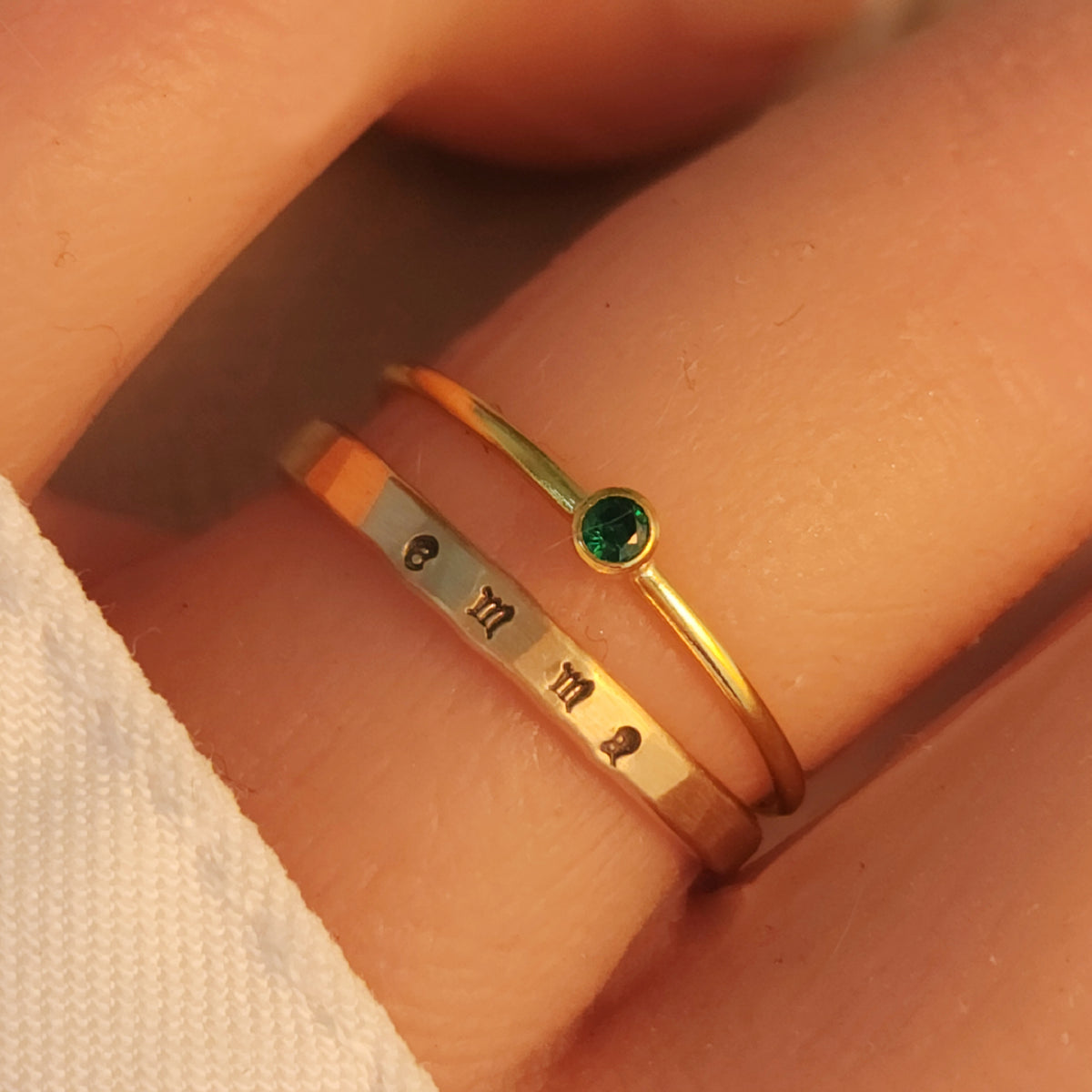name ring and birthstone ring combination on hand. Everyday jewelry for women personalized with a name and special birthstone