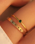 name ring and birthstone ring combination on hand. Everyday jewelry for women personalized with a name and special birthstone