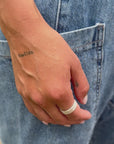 handcrafted-silver-ring-on-woman-hand-denim-outfit