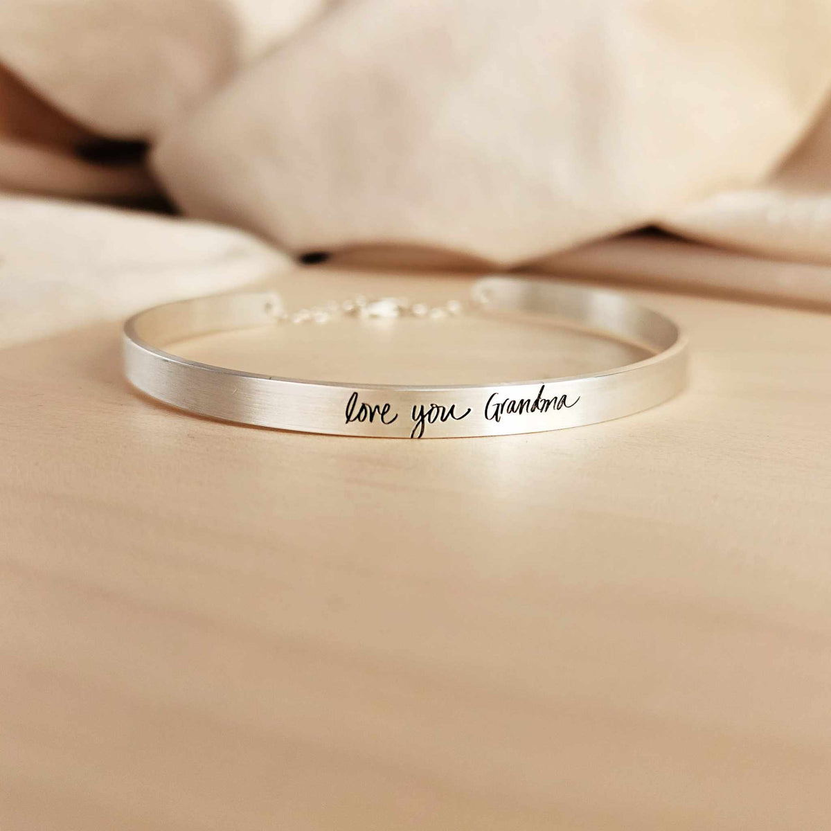 Custom handwriting cuff bracelet in sterling silver with personalized engraved message