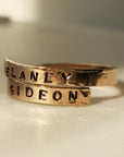 Adjustable gold filled wrap ring with stamped names Delaney and Gideon