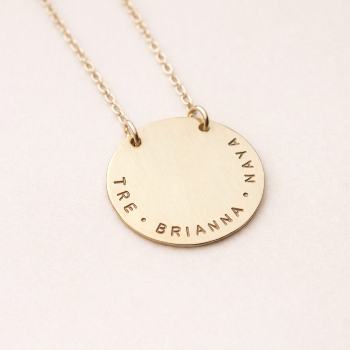 14K yellow gold stamped name round necklace with customizable 1-inch pendant on 18-inch cable chain