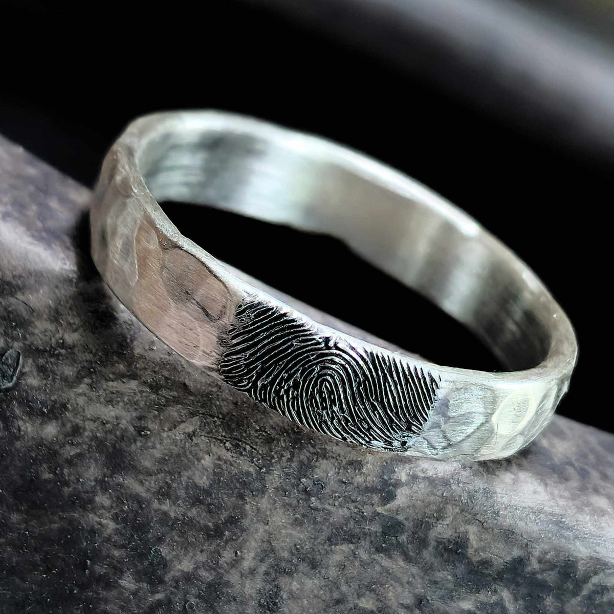 Handcrafted sterling silver fingerprint ring with hammered texture and oxidized engraving