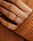 four delicate gold filled rings with a cross and cz stone.