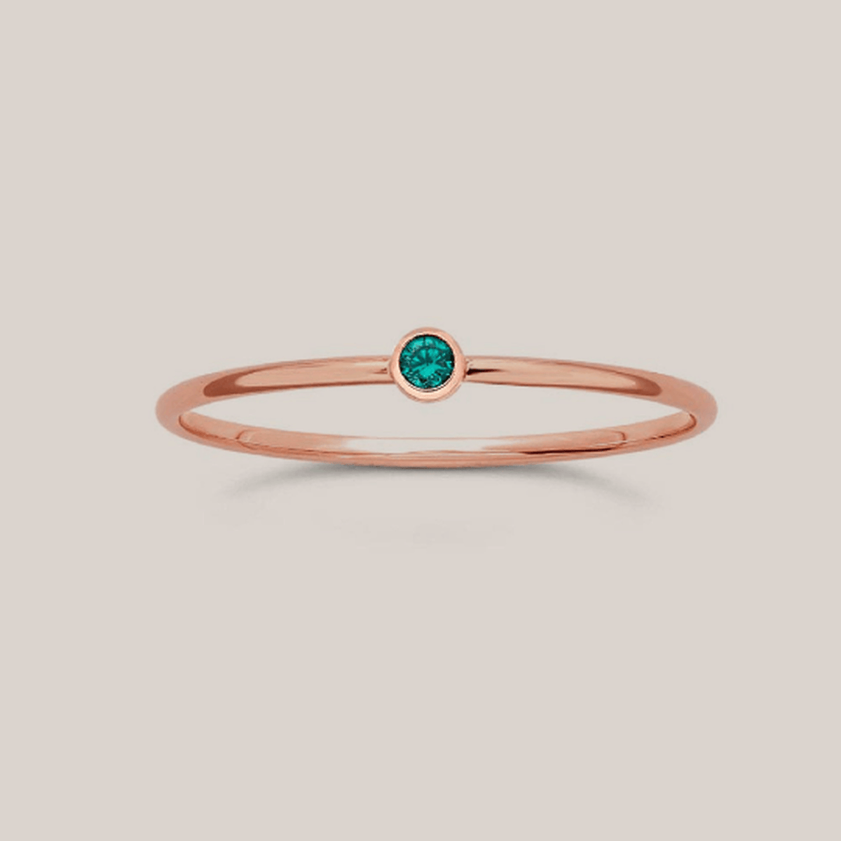 Delicate May birthstone ring with 1mm rose gold-filled band and 2mm green crystal centerpiece