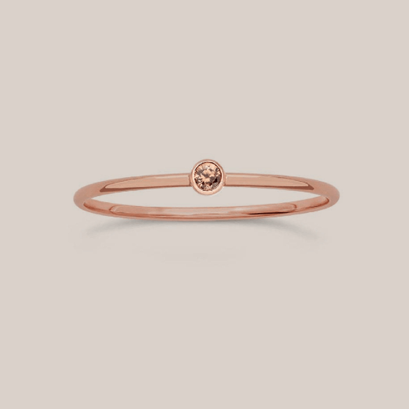 Dainty November stacking birthstone ring with 1mm rose gold filled band and 2mm citrine-colored crystal centerpiece.