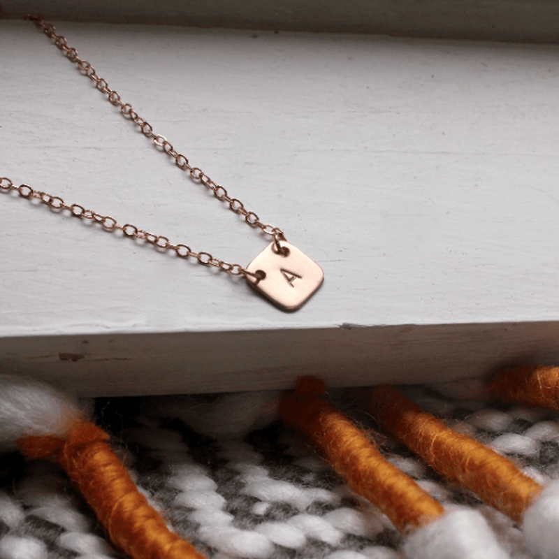 Square initial necklace with hand stamped undarkened letter on gold-filled chain with 20mm pendant