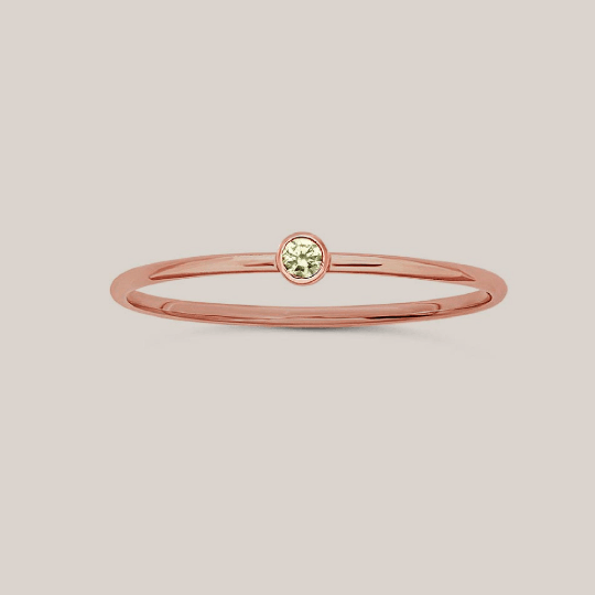 Elegant rose gold filled August birthstone stacking ring with a small crystal centerpiece.