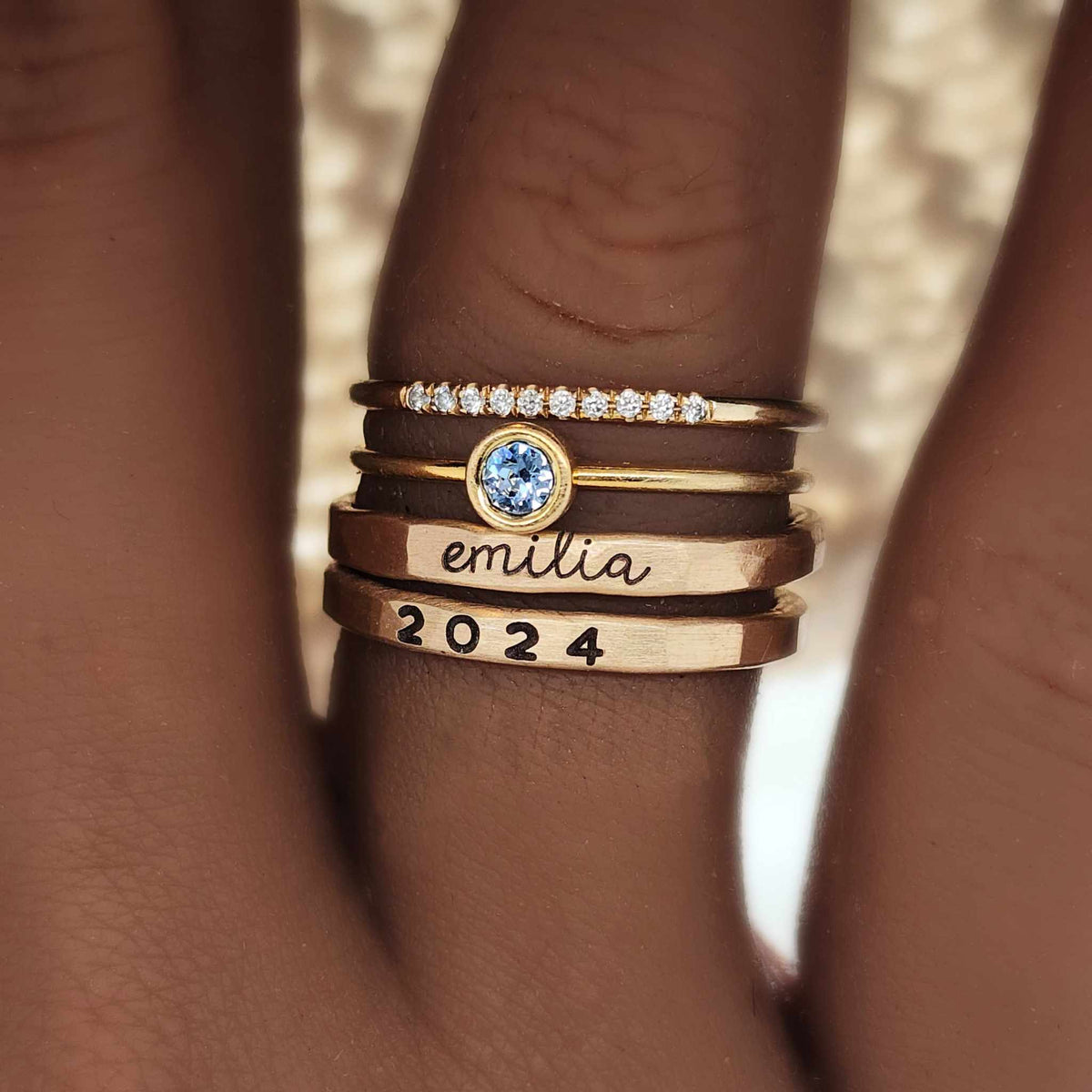 14K yellow gold filled modern class stacking ring set with cursive name, year 2024, and CZ stones on finger