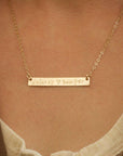 Gold bar necklace with "Delaney ♥ Sawyer" engraving