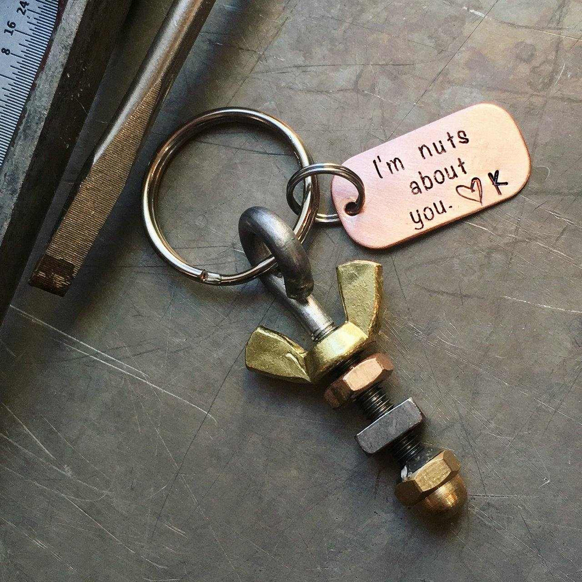 Nuts About You keychain with a bolt, spinning nuts, and personalized copper tag saying "I'm nuts about you."