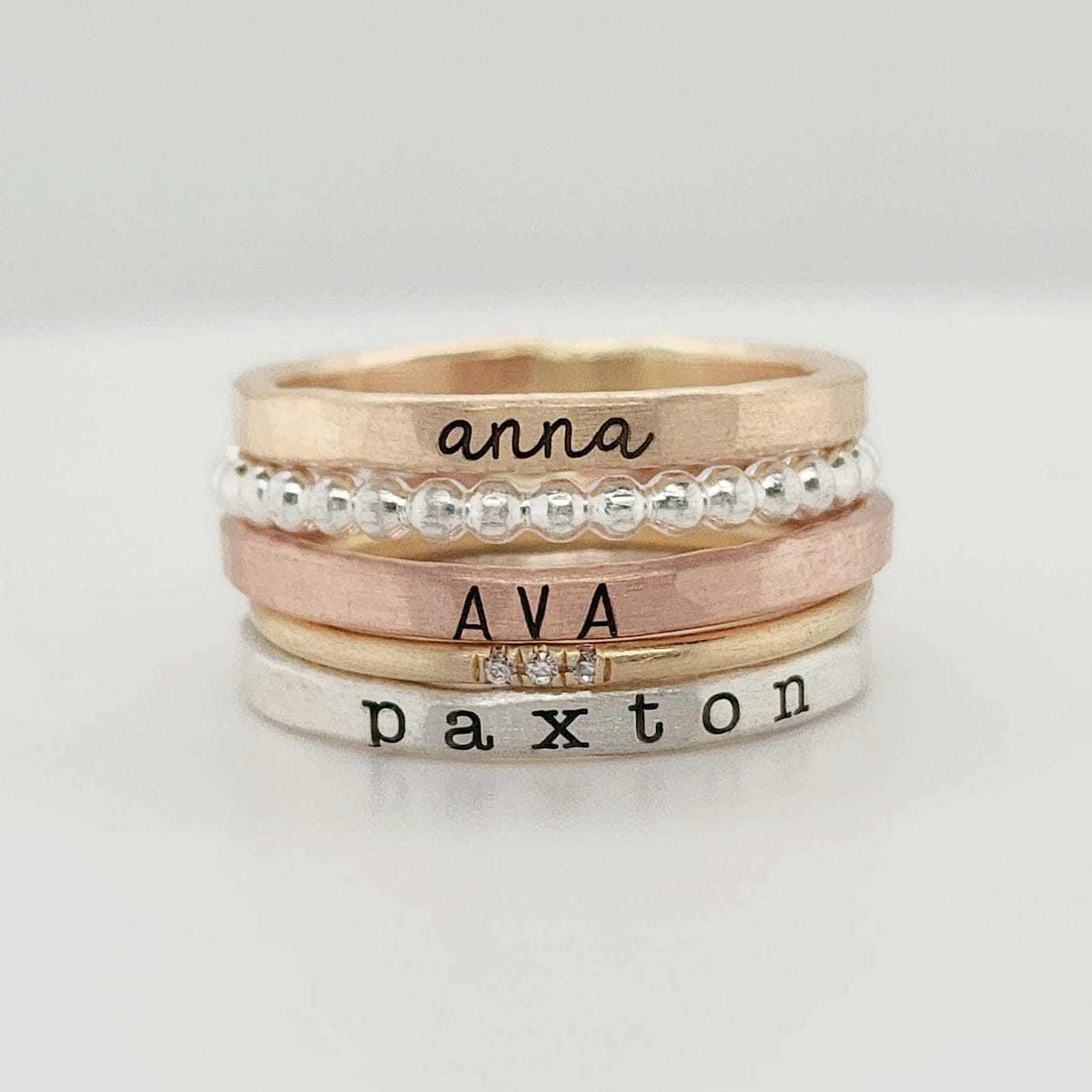Savannah Ring Set stackable personalized rings in yellow gold, rose gold, silver with names Anna, Ava, and Paxton