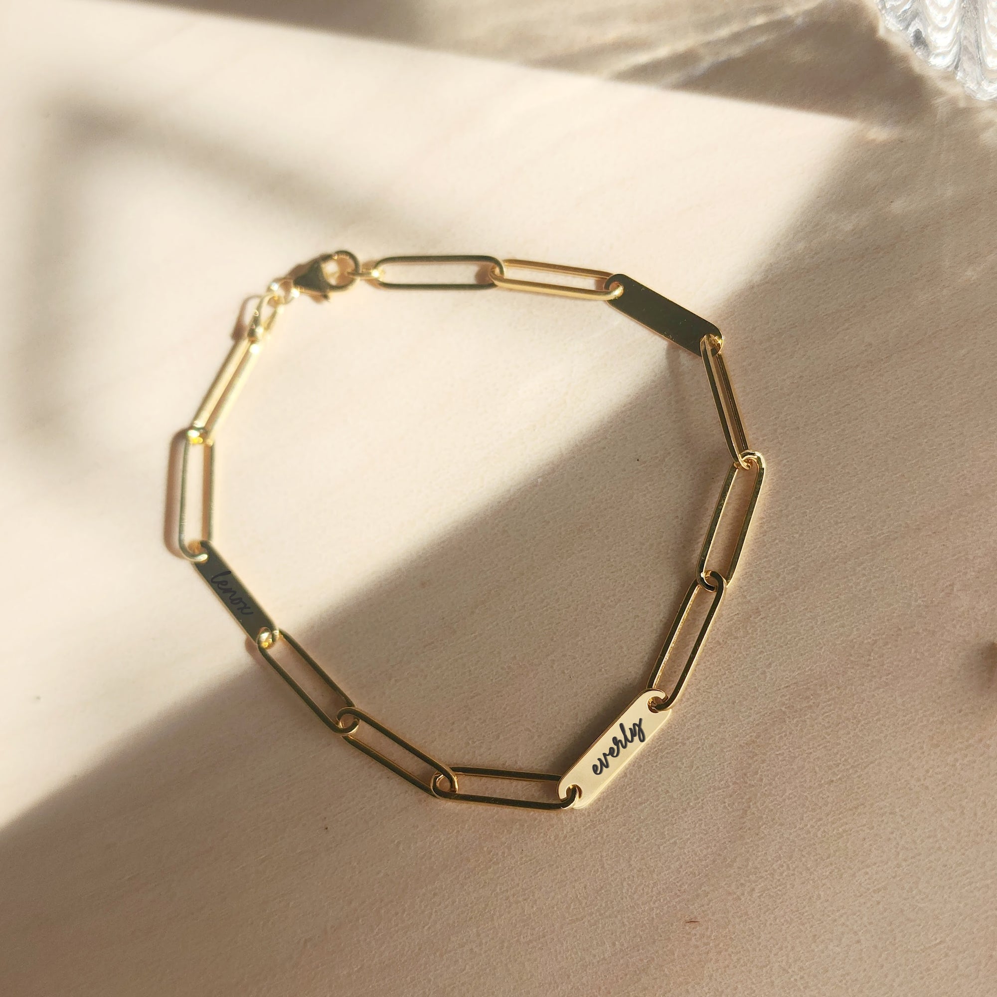 14K solid gold engravable bracelet with name bar links shown in natural lighting