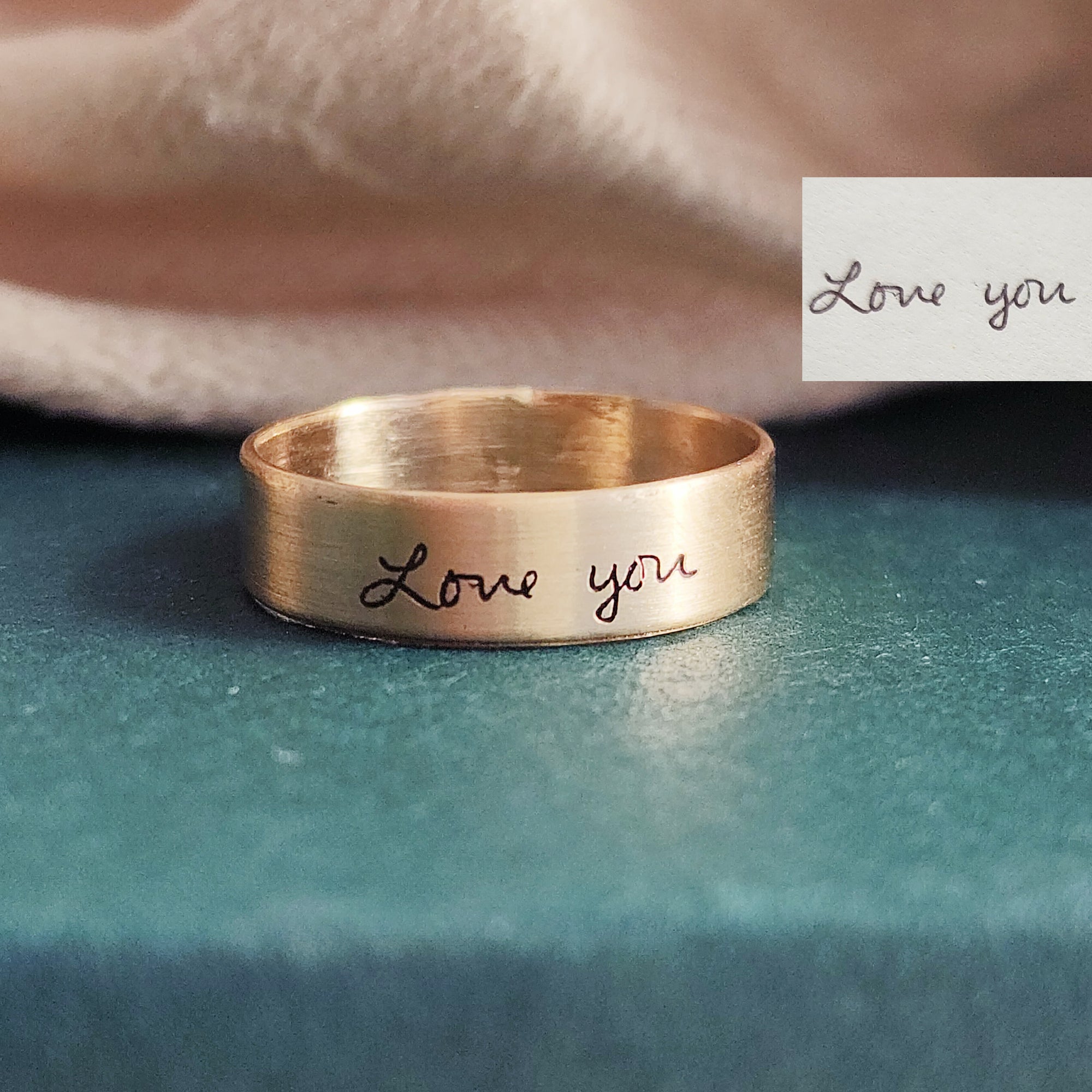 14K solid gold handwriting ring worn with necklace, woman’s hand resting near heart