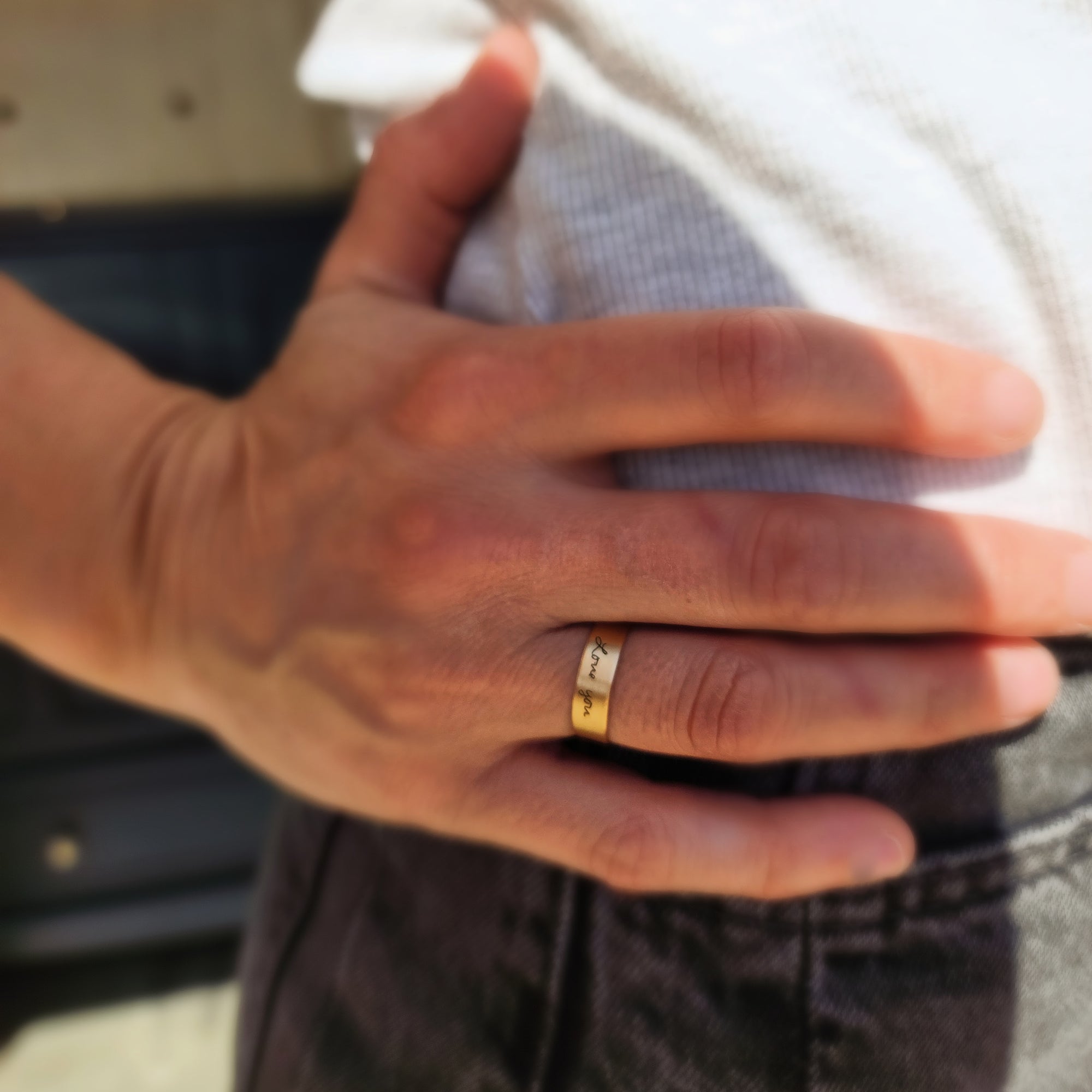 14k solid gold handwriting ring on model's hand resting on hip