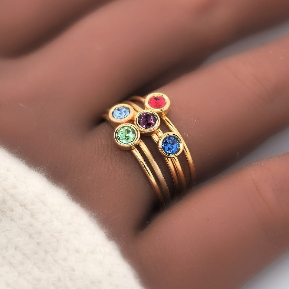 Large February Birthstone Ring stacked between other birthstone rings