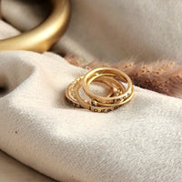 three personalized name rings engraved in our typewriter font, one beaded ring, one birthstone ring