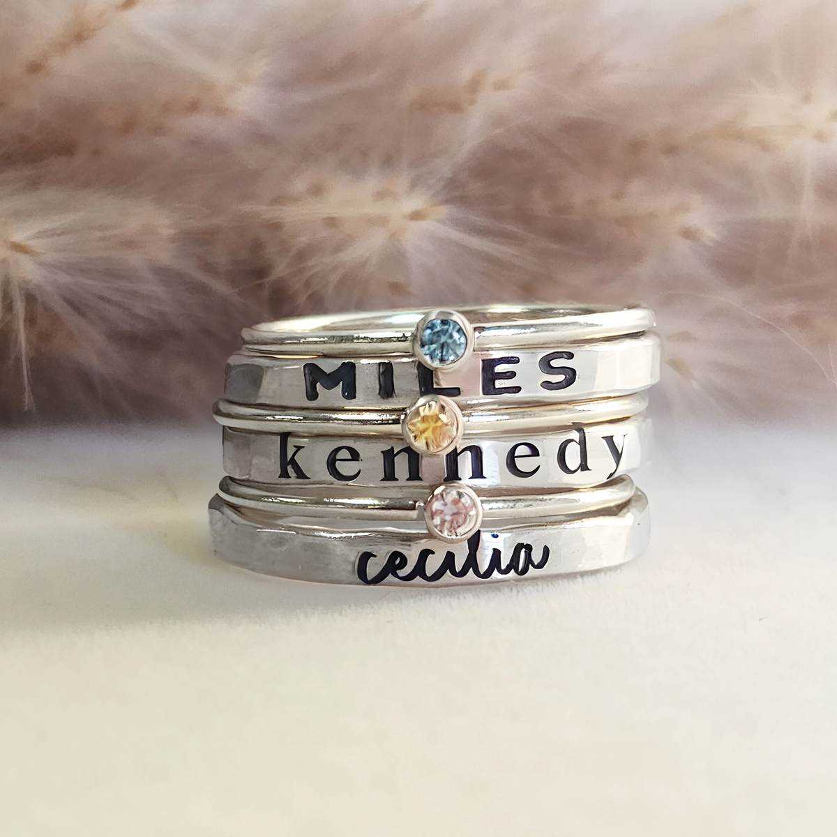 silver personalized handmade stacking rings engraved with names in different fonts