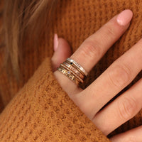 one fine silver personalized ring, one 14k rose gold filled personalized stacking ring, one 14k yellow gold filled personalized stacking ring mixed with one beaded ring and two birthstone rings